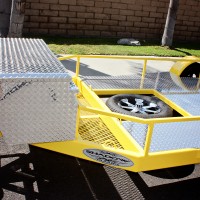 Mesh Storage Area, Spare Tire Location, 5 ft Polished Aluminum Diamond Plate Box and Deck.